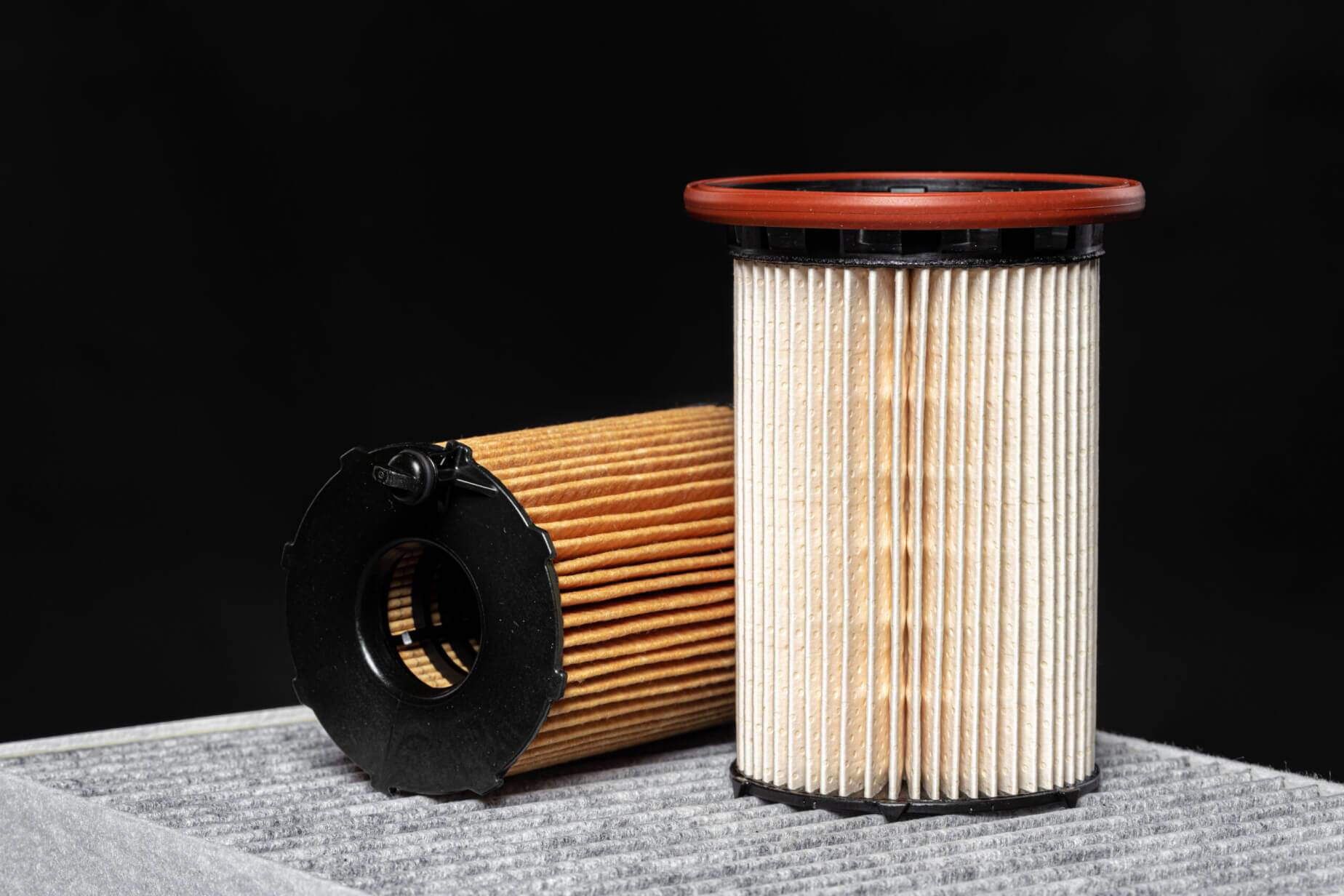 Car engine filter on dark background close up - Fuel Logic Fuel Filter