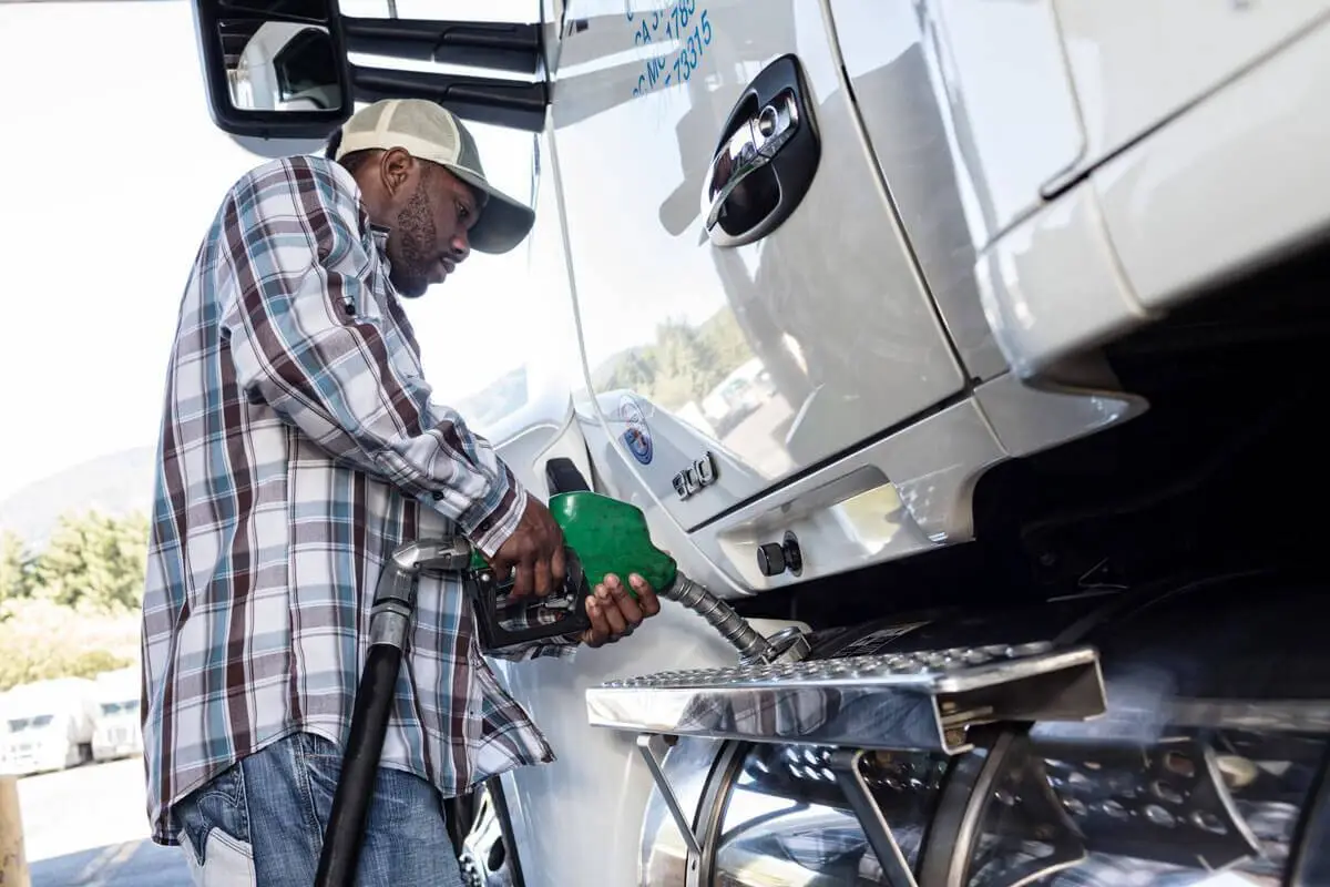 Intangable-cost-of-fuel--diesel-delviery-truck-driver-putting-diesel-fuel-in-his-202 - Fuel Logic intangible cost of fuel