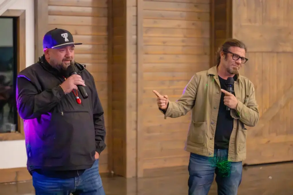 Eliot and Ezra singing karaoke at company event