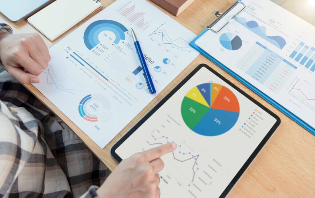 Businesswoman using a tablet to analysis graph company finance s - Fuel Logic