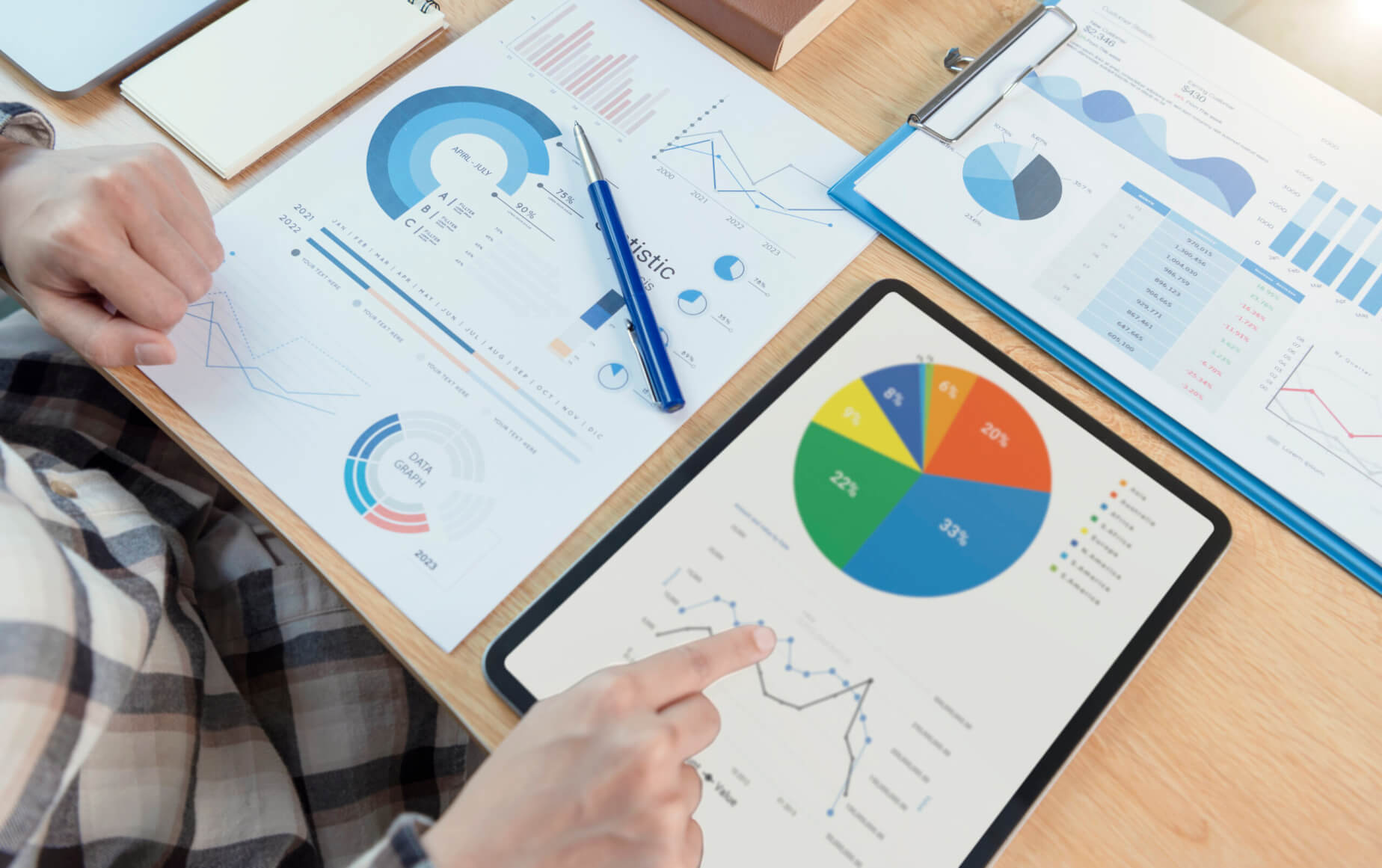 Businesswoman using a tablet to analysis graph company finance s - Fuel Logic